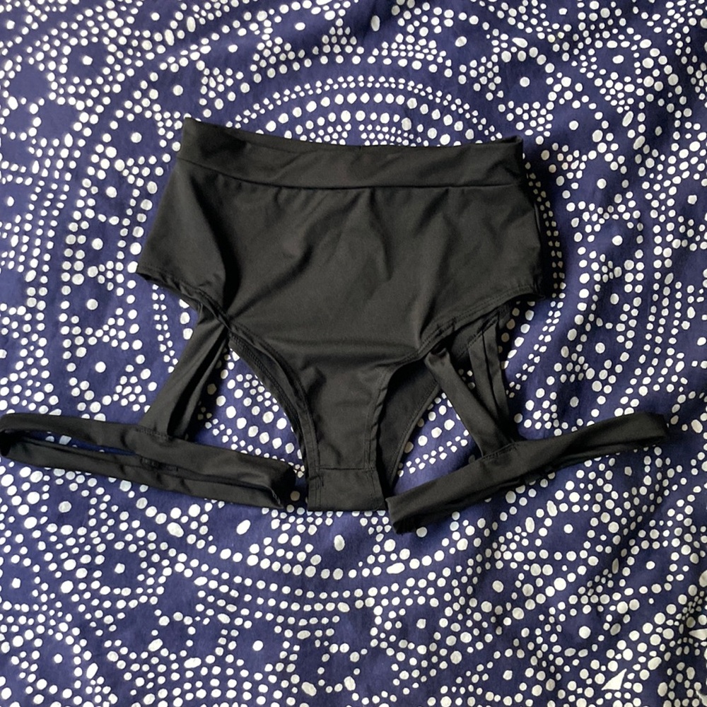 Black bootie shorts with attached garters.